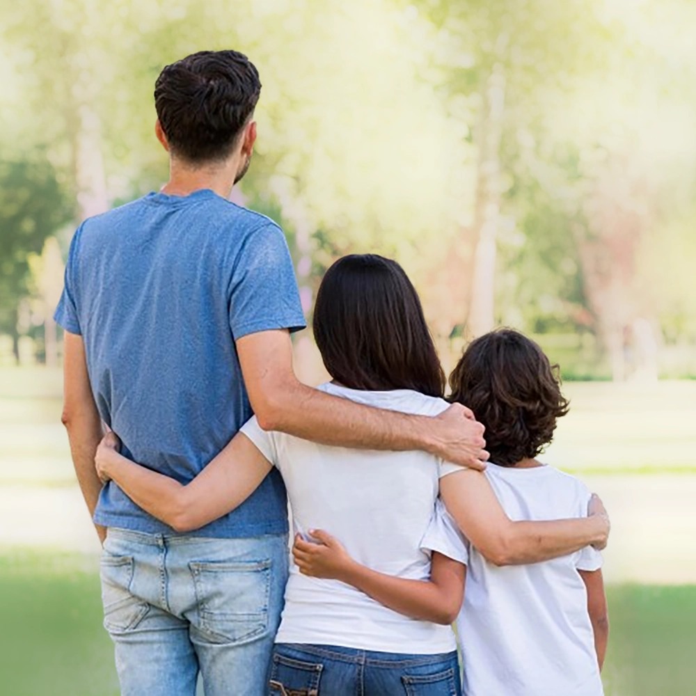 Family walking together, viewed from behind